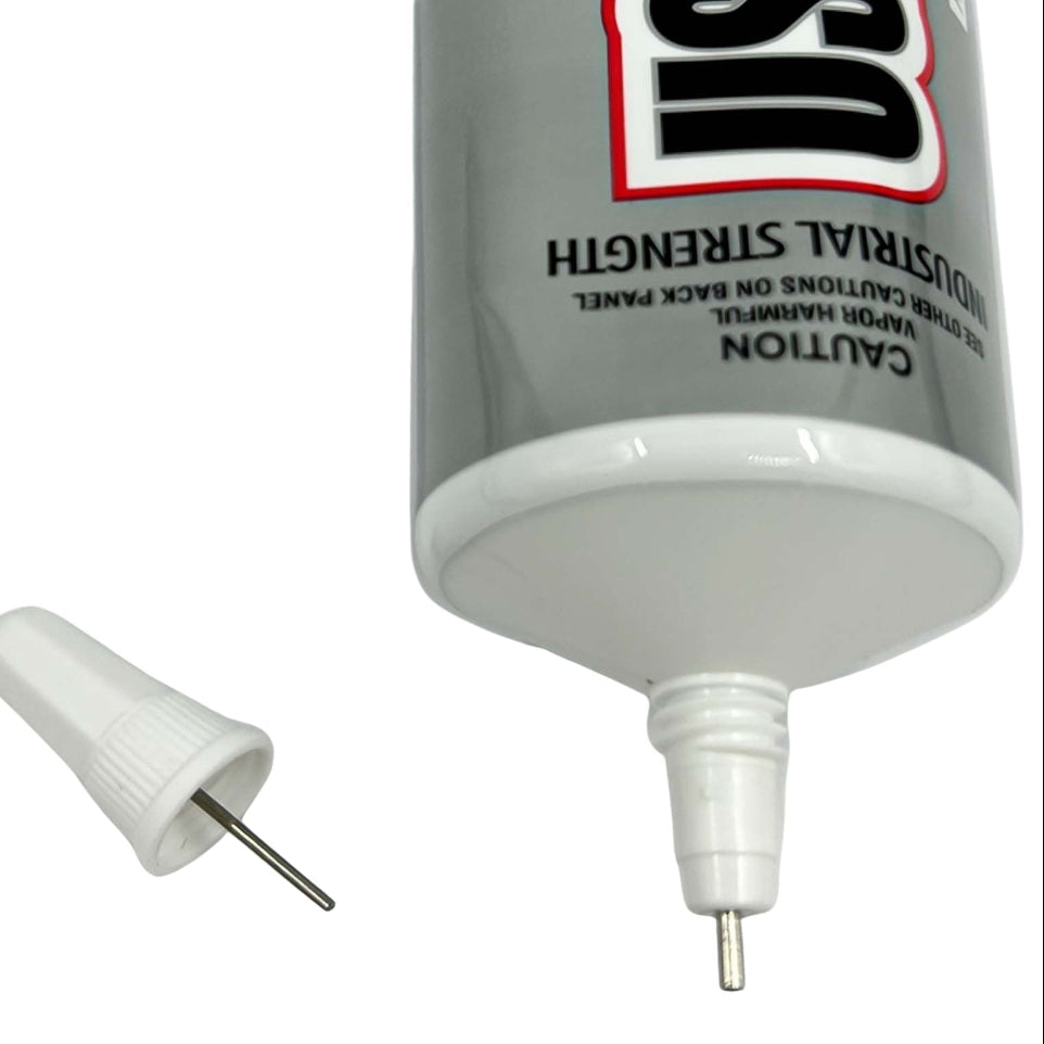 e6000 glue bottle with a needle applicator on a white background